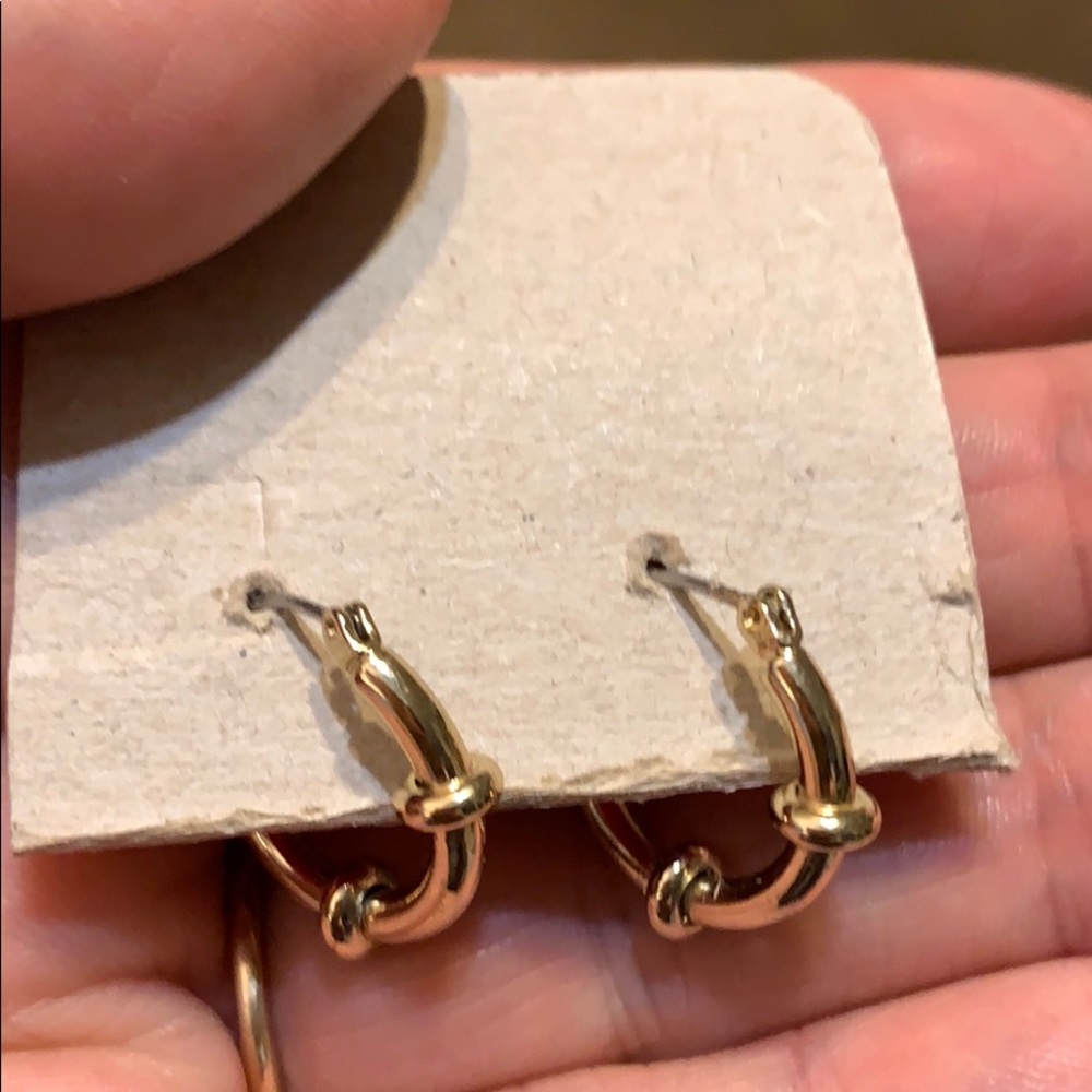 Pretty gold gold hoops. Never worn.